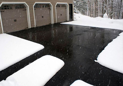 Heated asphalt driveway with heated walkways.