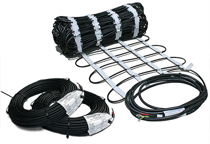 Heat cable and cable pre-spaced in mats for radiant driveway heating system.