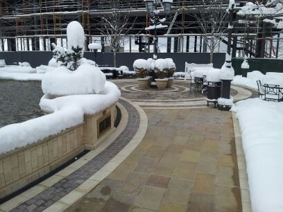 A full coverage radiant heated walkway and patio at outdoor mall.