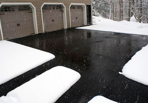 Heated driveway and walkways in asphalt.